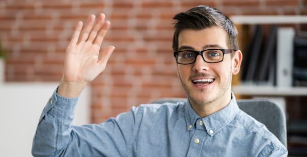 man lifting hand in greeting