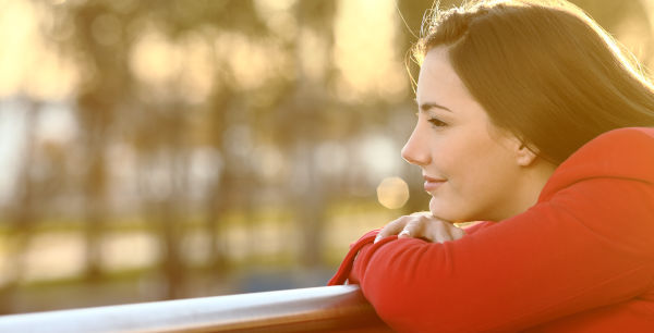 a woman looking hopefully into the future