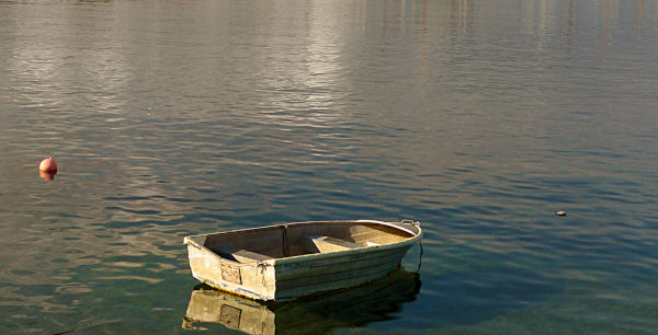 a small boat at anchor