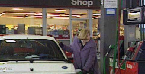 woman filling her car with petrol