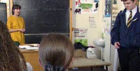 a teacher at a blackboard