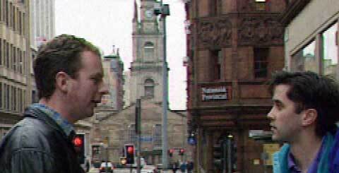 two men in a city centre