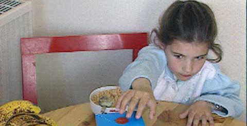 young girl at a table